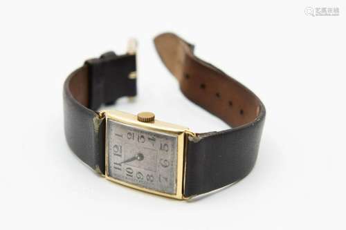 A 9CT GOLD AUDAX STRAP WATCH. Rectangular silver dial