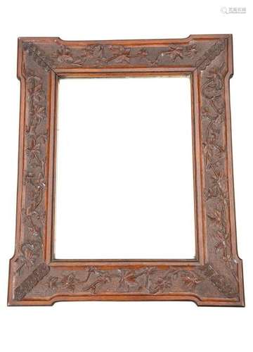 A VICTORIAN CARVED OAK MIRROR, the frame with