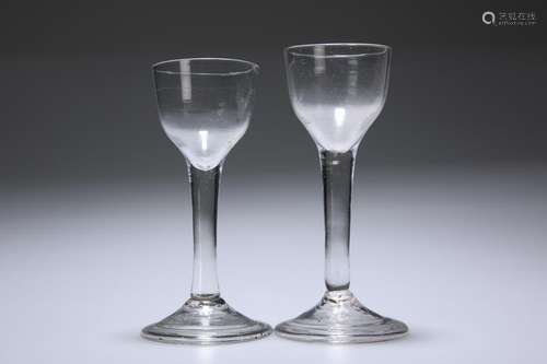 TWO 18TH CENTURY WINE GLASSES, each with plain cup bowl