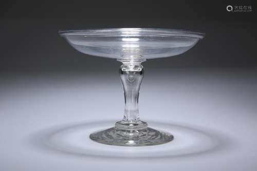 A GLASS TAZZA, c. 1800, the shallow circular bowl on an