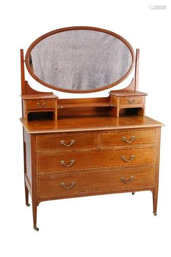 AN EDWARDIAN MAHOGANY DRESSING CHEST, with oval swing