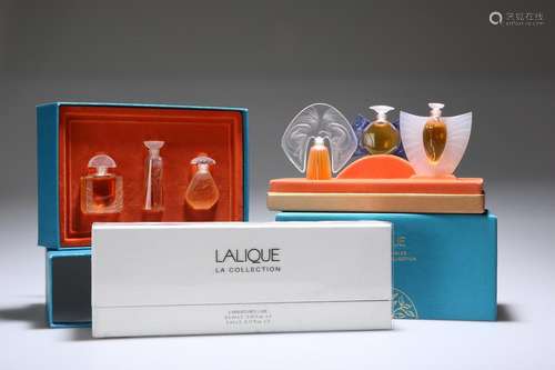 THREE BOXED LALIQUE SCENT BOTTLE SETS, including two