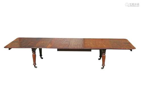 A LARGE MAHOGANY TELESCOPIC DINING TABLE, FIRST HALF OF