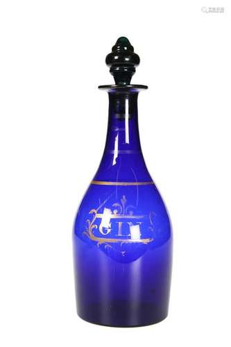 A BRISTOL BLUE GLASS GIN DECANTER, with gilded label.