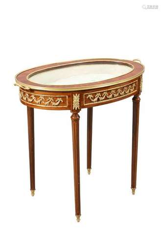 A FRENCH GILT-METAL MOUNTED OVAL BIJOUTERIE TABLE, the