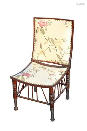 A LIBERTY & CO MAHOGANY AND UPHOLSTERED 