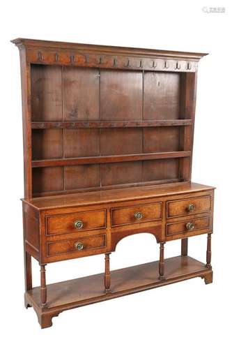 A GEORGE III OAK POTBOARD DRESSER AND RACK, the