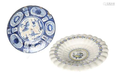 TWO CONTINENTAL TIN-GLAZED PLATES, 18TH CENTURY, the