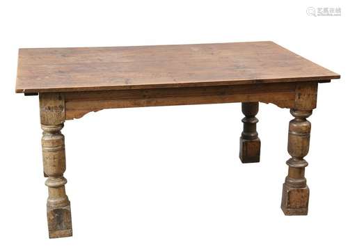 AN OAK TABLE, with boarded top, raised on cup and cover