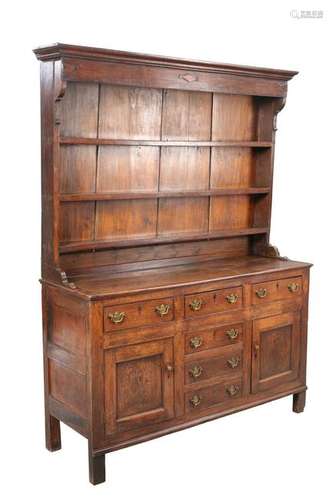 A GEORGE III OAK DRESSER AND RACK, the enclosed rack