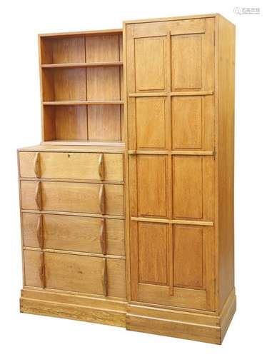 A COTSWOLD SCHOOL OAK COMBINATION WARDROBE, TO A DESIGN