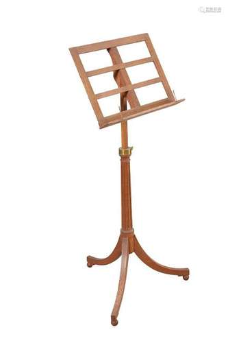 A REGENCY STYLE OAK RISE AND FALL MUSIC STAND, with