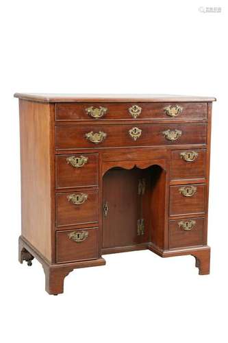 A GEORGE III MAHOGANY KNEE HOLE DESK, the moulded