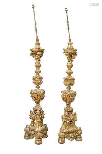 A PAIR OF ITALIAN GILTWOOD ALTAR CANDLESTICKS, 19TH