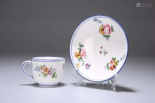 A SEVRES CUP AND SAUCER, 18TH CENTURY, each painted