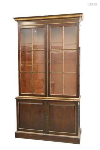 AN EARLY 19TH CENTURY MAHOGANY AND PARCEL-GILT BOOKCASE