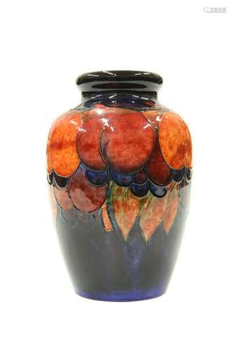 A WALTER MOORCROFT FLAMBE POTTERY VASE, of shouldered