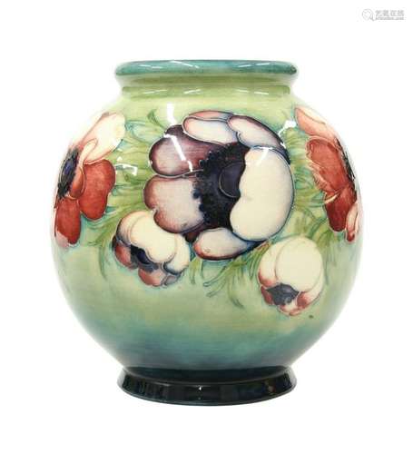 A WALTER MOORCROFT POTTERY VASE, the globular body