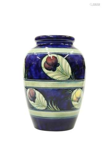 A WILLIAM MOORCROFT POTTERY VASE, of swollen barrel