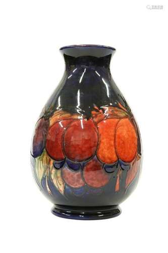 A WILLIAM MOORCROFT FLAMBE POTTERY VASE, of slightly