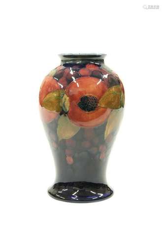 A WILLIAM MOORCROFT POTTERY VASE, of baluster form with