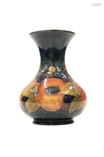 A WILLIAM MOORCROFT POTTERY VASE, of squat form with