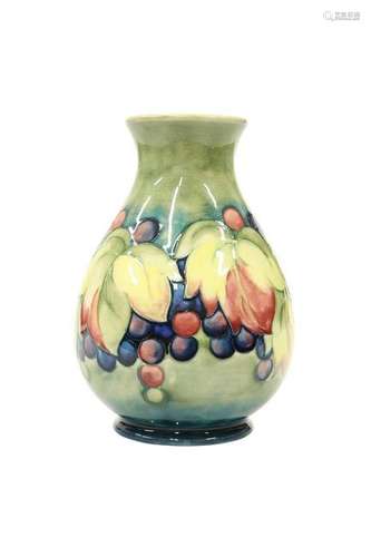 A WALTER MOORCROFT POTTERY VASE, of baluster form,