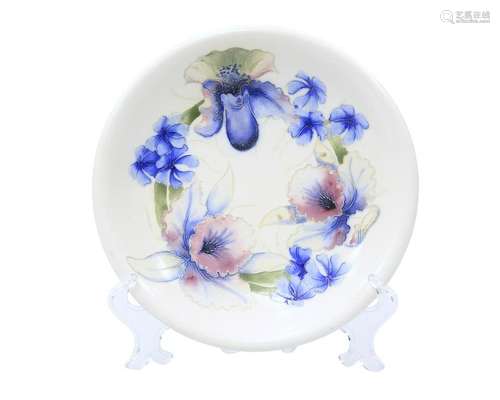 A MOORCROFT SALT-GLAZED PLATE, tubelined and