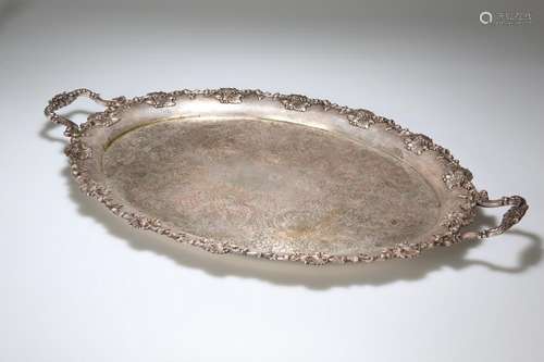 A LARGE LATE VICTORIAN SILVER-PLATED TWO-HANDLED TRAY,