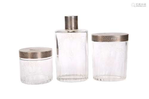 A SET OF THREE GEORGE V SILVER-TOPPED CUT GLASS