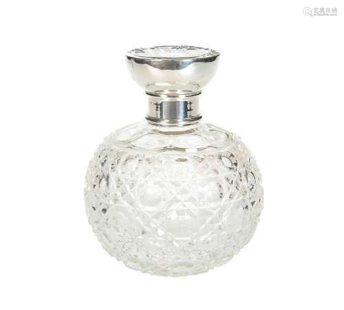 AN EDWARDIAN SILVER-TOPPED CUT-GLASS SCENT BOTTLE,