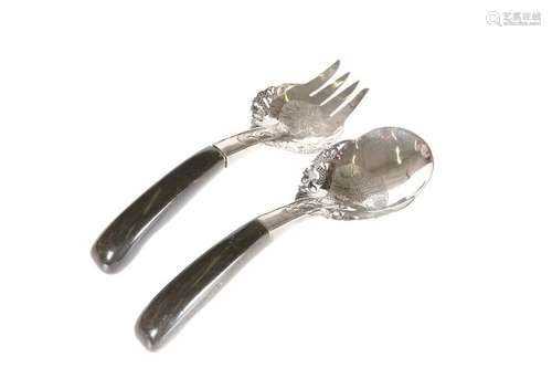 A WHITE METAL SERVING SPOON AND FORK, PROBABLY