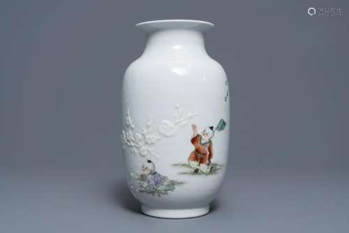 A Chinese famille rose relief-decorated vase with