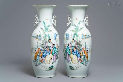 A pair of Chinese famille rose vases with scholars in a
