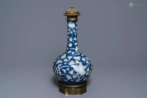 A Chinese blue-ground slip-decorated bottle vase with