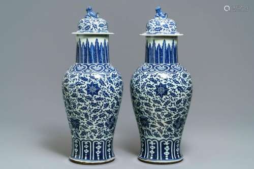 A pair of Chinese blue and white vases and covers with