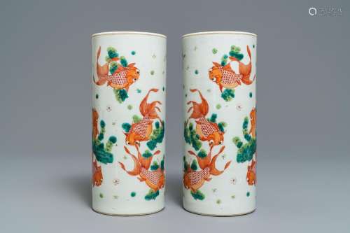 A pair of Chinese iron-red 'gold fish' hat stands,