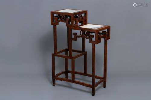 A double Chinese wooden display stand with marble tops,