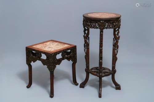 Two Chinese carved wooden stands with marble tops,