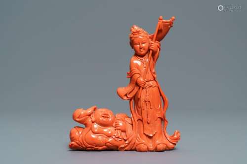 A Chinese carved coral group with a laughing Buddha,