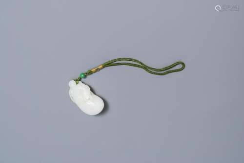 A Chinese white jade pendant of a monkey on a pouch,