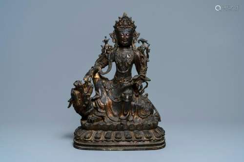 A large Chinese bronze group of Guanyin on a dragon,