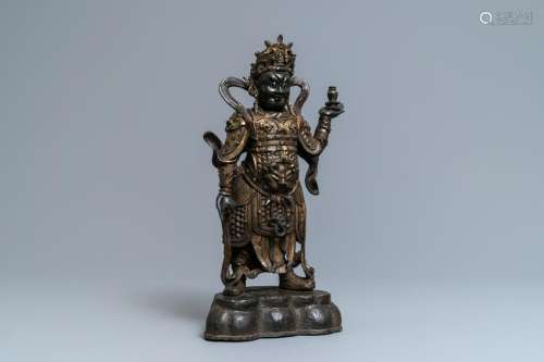 A Chinese gilt-lacquered bronze figure of Weituo, Ming