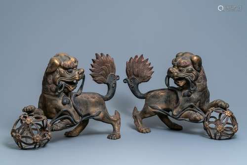 A pair of large Chinese gilt-lacquered bronze Buddhist