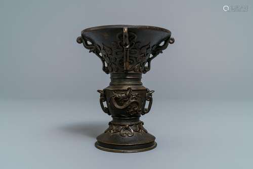 A Chinese relief-decorated bronze 'gu' vase with