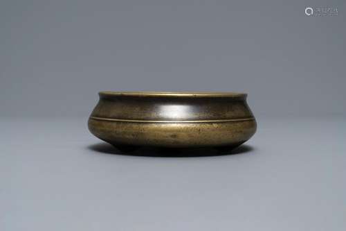 A flat Chinese bronze tripod censer, Xuande mark, 18th