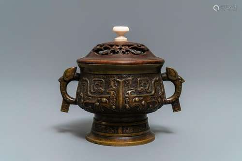 A Chinese bronze censer with wooden cover, Xuande mark,