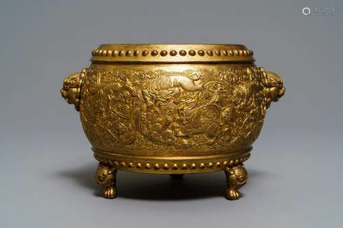 A Chinese gilt bronze tripod censer with buddhist