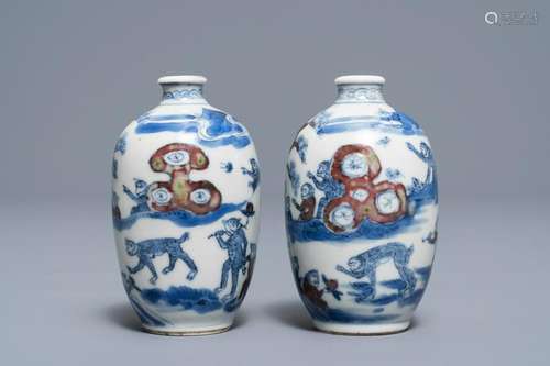 A pair of Chinese blue, white and underglaze red '16