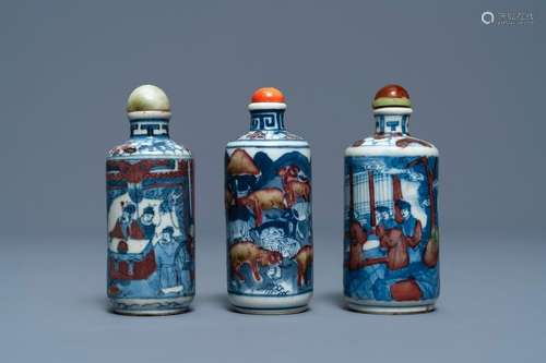 Three Chinese blue, white and underglaze red snuff